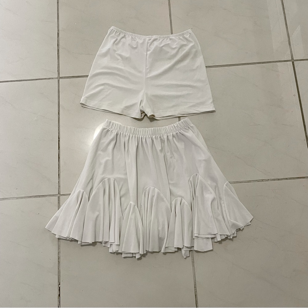 white pleated skirt.  has tights.